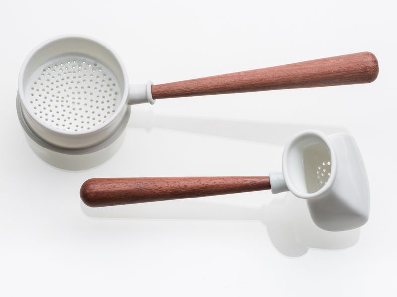 Prue Venables. Pair of white tea strainers with wooden handles. 2017.